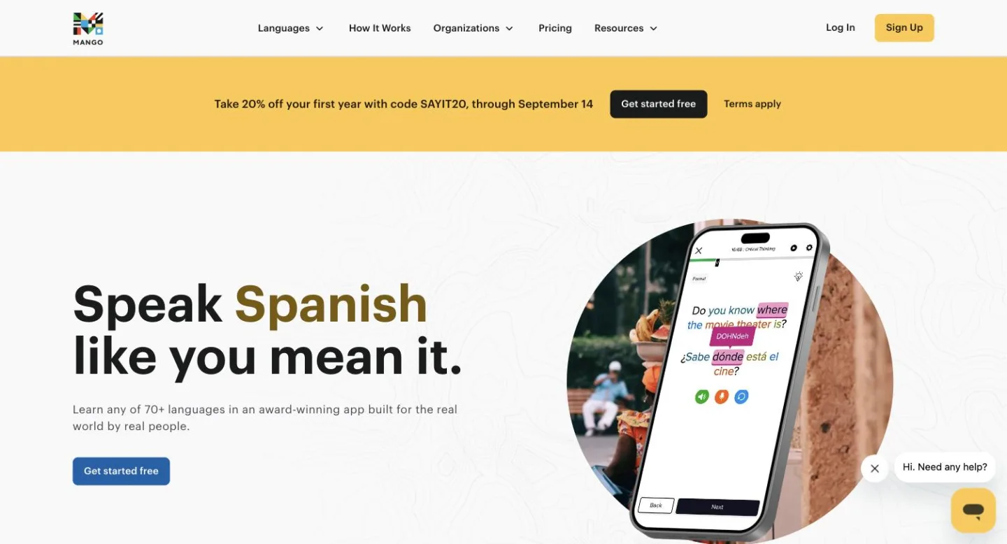 The Mango Languages home page, showing its phone app with a Spanish phrase broken into highlighted words.